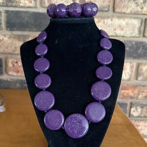Purple sparkling graduated disc beaded necklace with matching bracelet